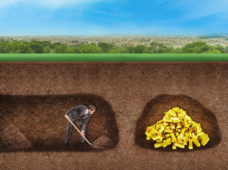 Businessman digs a tunnel to treasure