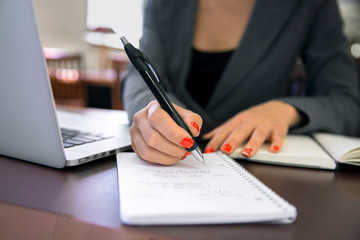 Paperwork business woman notebook jotting writing notes organizing 