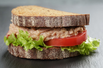 Sandwich with tuna and vegetables on rye bread