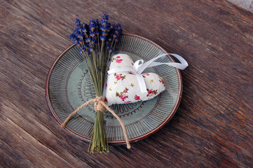 lavender flower and lavender bag on wooden table