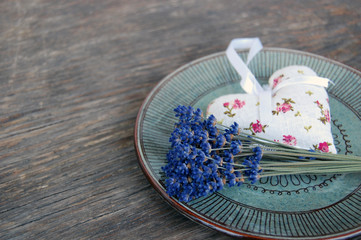 lavender flower and lavender bag on wooden table