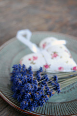 lavender flower and lavender bag on wooden table