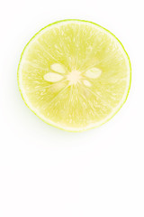 Top view of lime slice on white
