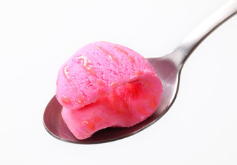 Pink ice cream on spoon
