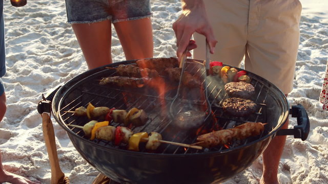Close up of friends having barbecue together