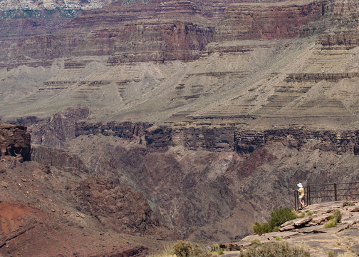 Grand Canyon Woman Hike. South Rim, Arizona, USA. Giant Rock formations and minute human posture.
