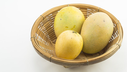 Isolated Mangoes in basket