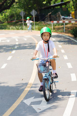 Fototapeta premium Boy practice biking on the road