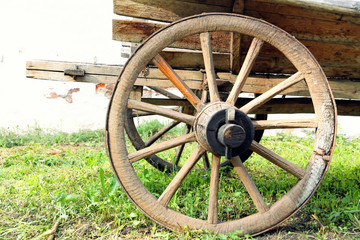 Retro wooden cart wheel taken closeup.