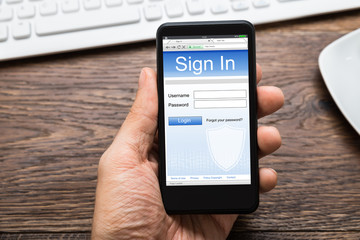 Person Hands With Mobile Phone Showing Signing Of Account