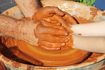 Potter hands wheel pottery work workshop teacher and little pupi