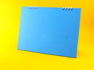 blue calendar blank on yellow background