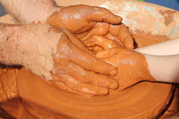 Potter hands wheel pottery work workshop teacher and little pupi