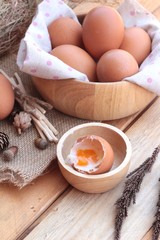 soft-boiled egg and eggs on wood background