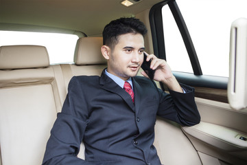 Young businessperson speaking on the phone