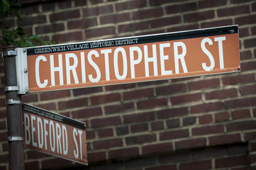 Street sign for Christopher Street, the traditional gay neighborhood in the historic district of Greenwich Village New York City