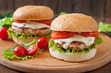 Appetizing hamburger with chicken burger and sauce Tartar