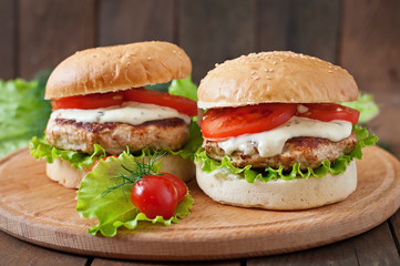 Appetizing hamburger with chicken burger and sauce Tartar