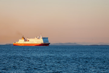 Ferry on the sea at sunset