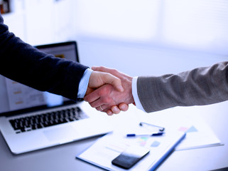 Close-up of a business handshake Laptop