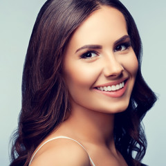 Fototapeta premium Portrait of smiling young lovely woman
