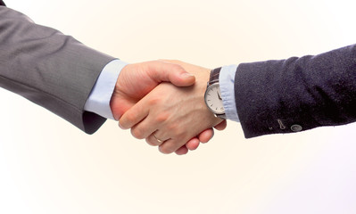 Closeup of a business handshake, on white background