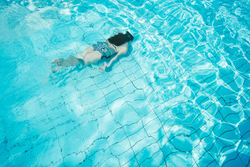 Girl swimming in pool