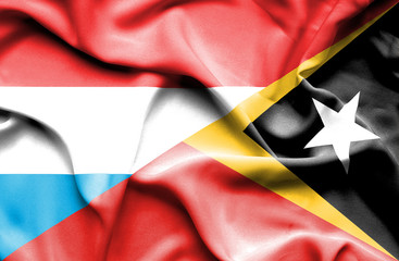 Waving flag of East Timor and Luxembourg