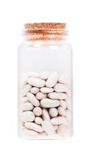 White kidney bean in a glass bottle with cork stopper, isolated