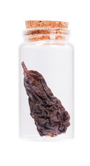Dried pear in a glass bottle with cork stopper, isolated on whit