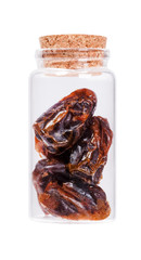 Dates in a glass bottle with cork stopper, isolated on white.