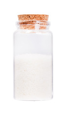 Coconut in a glass bottle with cork stopper, isolated on white.
