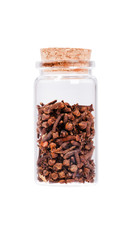 Dried cloves in a glass bottle with cork stopper, isolated on wh