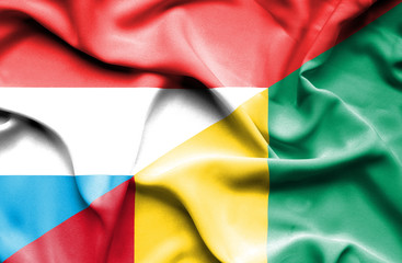 Waving flag of Guinea and Luxembourg