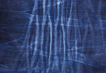  texture of blue jeans with pleats