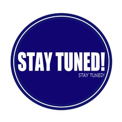 STAY TUNED white stamp text on blue
