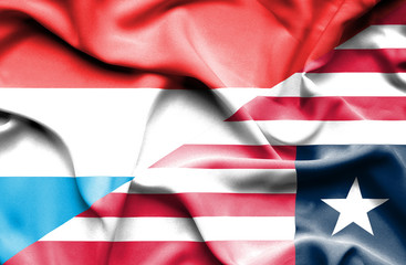 Waving flag of Liberia and Luxembourg