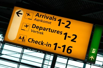 Fotobehang Directional sign inside Schiphol International Airport, Amsterdam © Natalia Bratslavsky