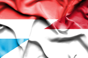 Waving flag of Monaco and Luxembourg