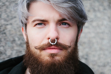 Bearded hipster with nose ring in leather jacket - 86372070