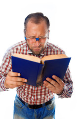 geek with poor eyesight reading a book