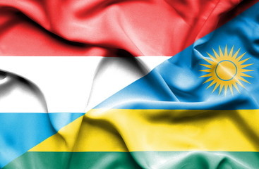 Waving flag of Rwanda and Luxembourg