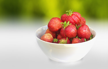 Fresh strawberries in a ceramic bowl