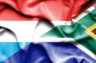Obraz premium Waving flag of South Africa and Luxembourg