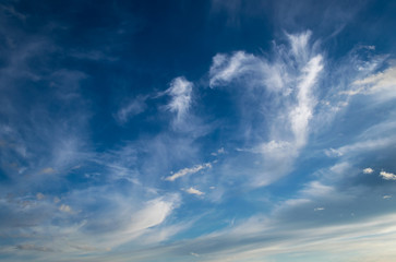 Dramatic sky with white clouds.