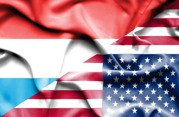 Fototapeta premium Waving flag of United States of America and Luxembourg