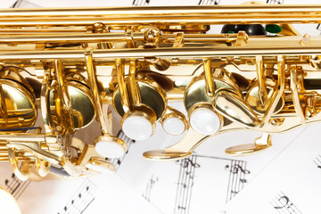 Obraz na płótnie Canvas Shiny golden alto saxophone keys close-up view