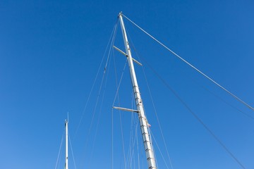 Mast of big white ship moored in port