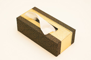 brown and golden tissues box isolated on white background	