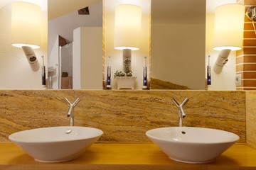 Two washbowls in modern bathroom